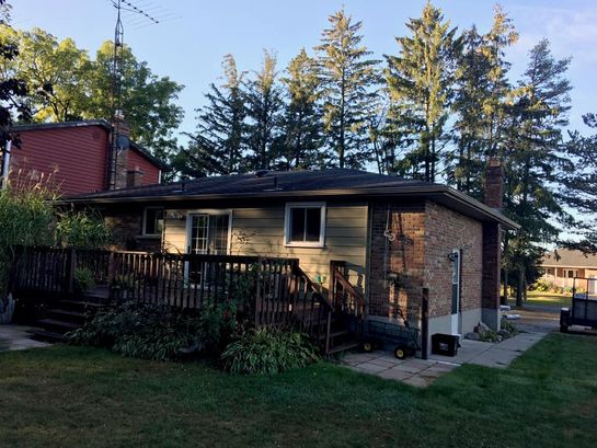 Before: roof 26 before its new metal roof