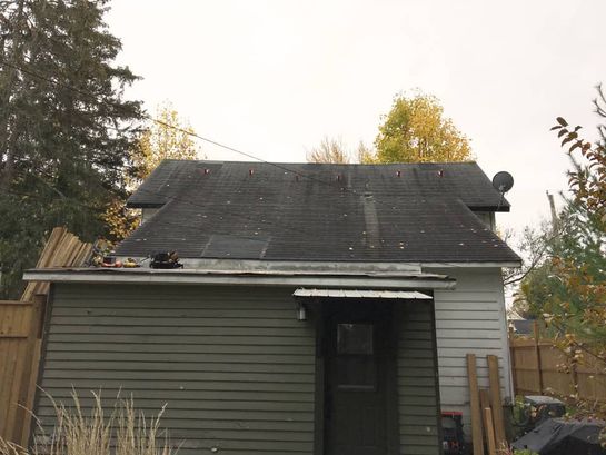 Before: roof 18 before its new metal roof