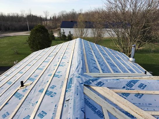 Before: roof 11 before its new metal roof