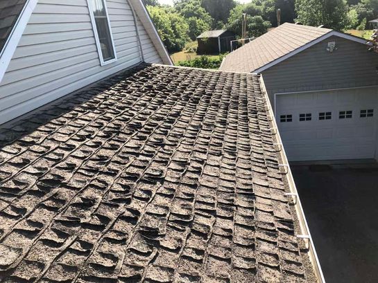 Before: roof 5 before its new metal roof