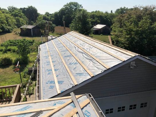 Before: roof 1 before its new metal roof
