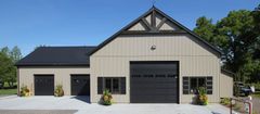 Garage with a metal roof and siding
